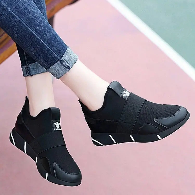 Showlu women's black casual sport sneakers with breathable mesh upper, comfortable design, suitable for running and everyday wear.