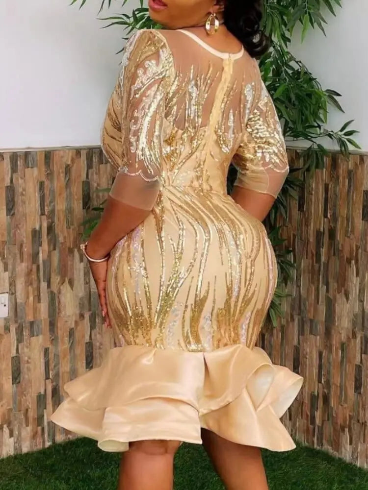 A woman wearing a Showlu Fashion African-style sequined mesh sheath dress with three-quarter sleeves for evening celebrations.