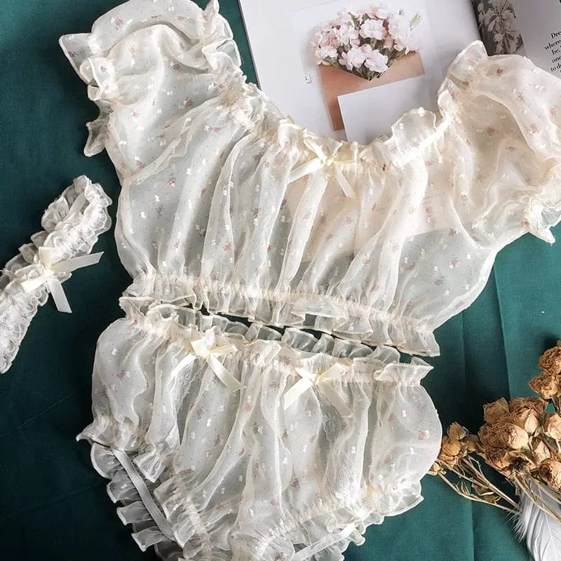 Women’s sheer star ruffle pajama set by Anel Demosthene, featuring off-shoulder tops and matching shorts with delicate ruffles.