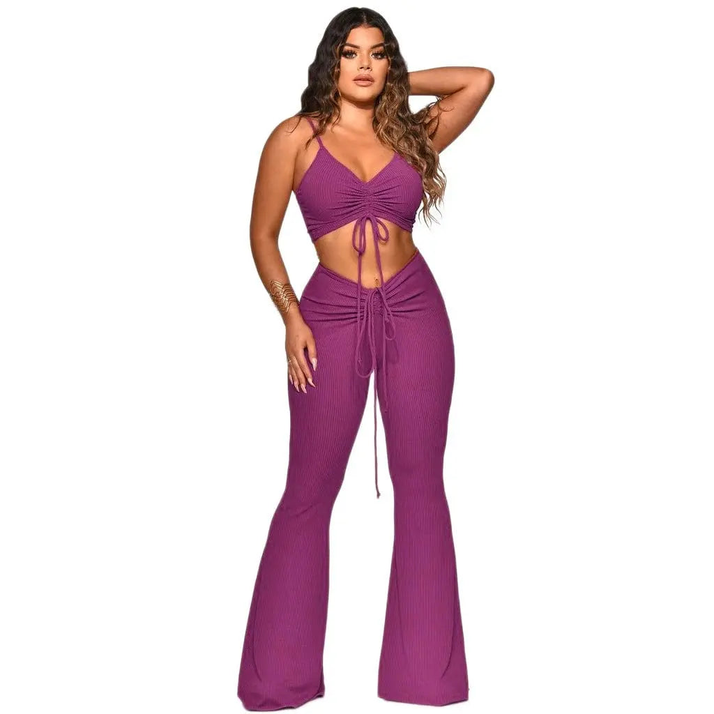 Women’s two-piece summer outfit by Showlu Fashion featuring a nylon tank top and matching long pants, casual and stylish for warm weather.