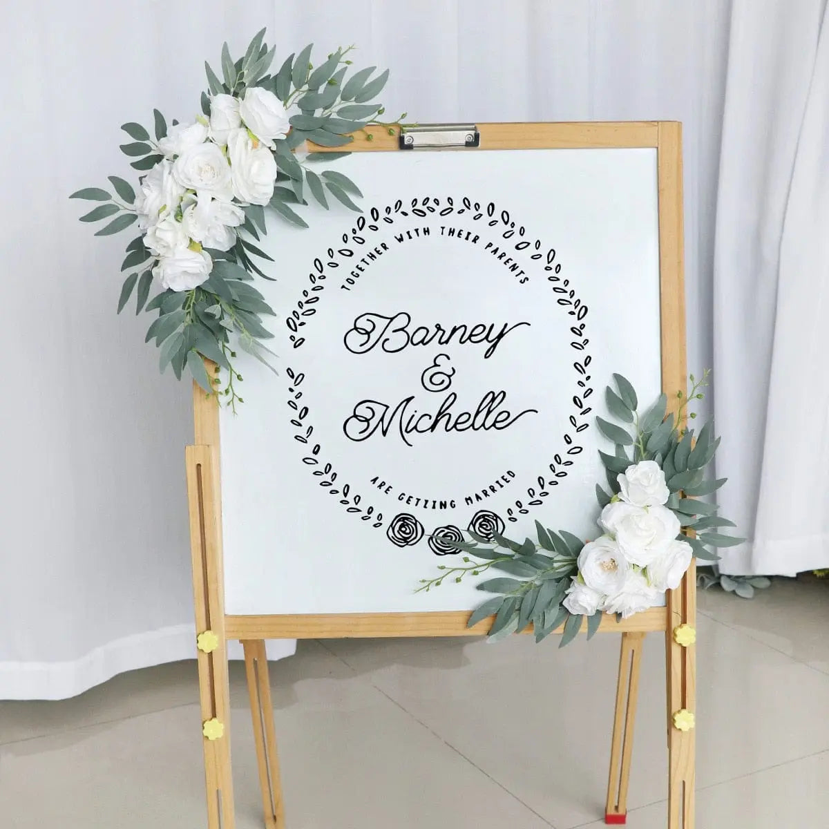 Artificial wedding arch flowers kit with dusty rose silk garland, eucalyptus accents, and drapes for wedding decor.
