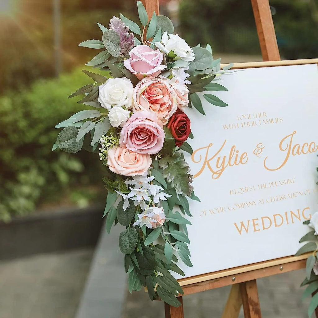 Artificial wedding arch flowers kit with dusty rose silk garland, eucalyptus accents, suitable for boho wedding decor and arch drapes.