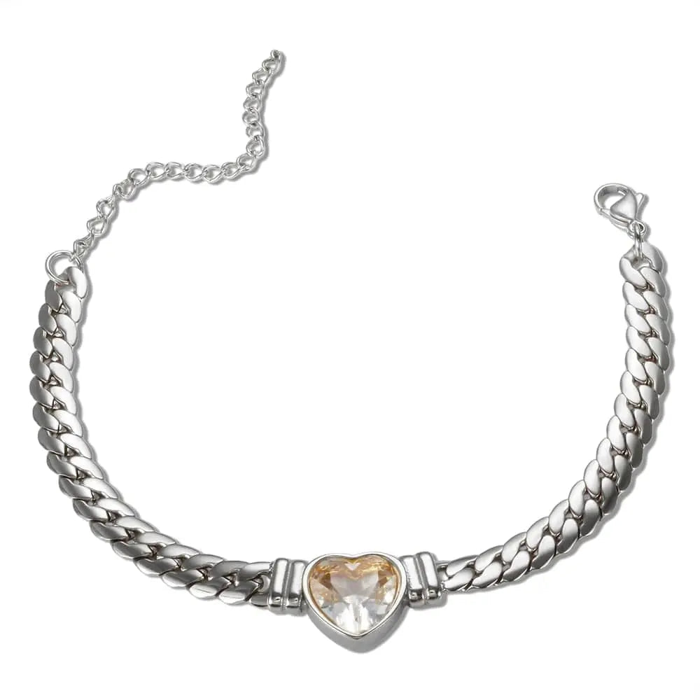 Gold-plated stainless steel heart necklace and nail bracelet set with luxury love design, perfect for women.