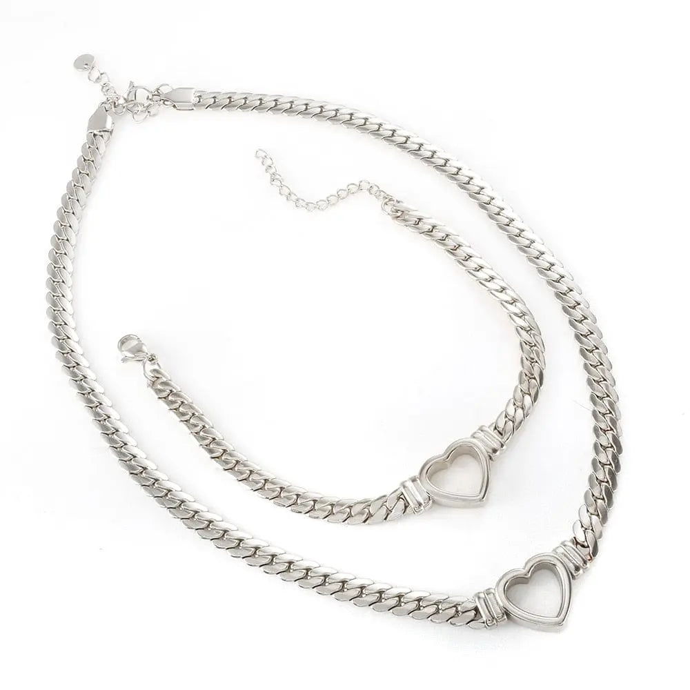 Gold-plated stainless steel heart necklace and nail bracelet set featuring a love heart chain design for women.