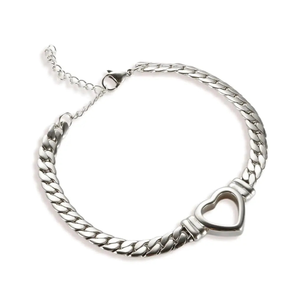 Gold-plated stainless steel heart necklace and nail bracelet set featuring luxury love design for women.