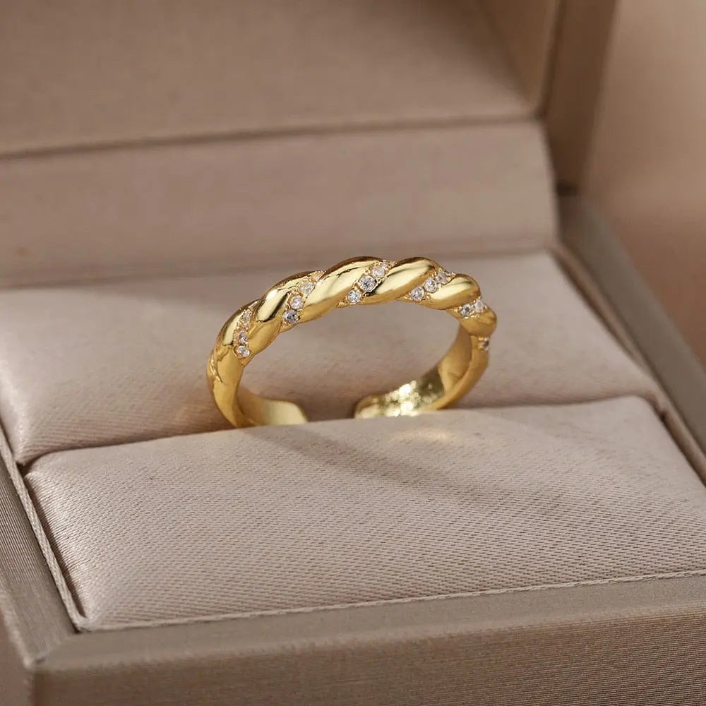 Gold stainless steel wedding ring with zircon stones from Showlu Store Nation, featuring a sleek band design for women.