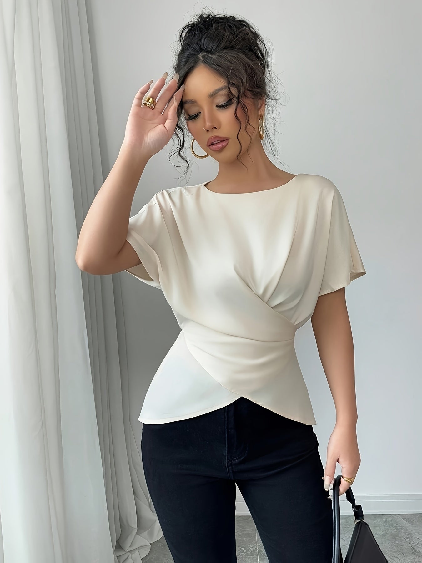 SHOWLU Women's off-shoulder asymmetrical hem blouse with short sleeves, stylish and lightweight top for casual wear.