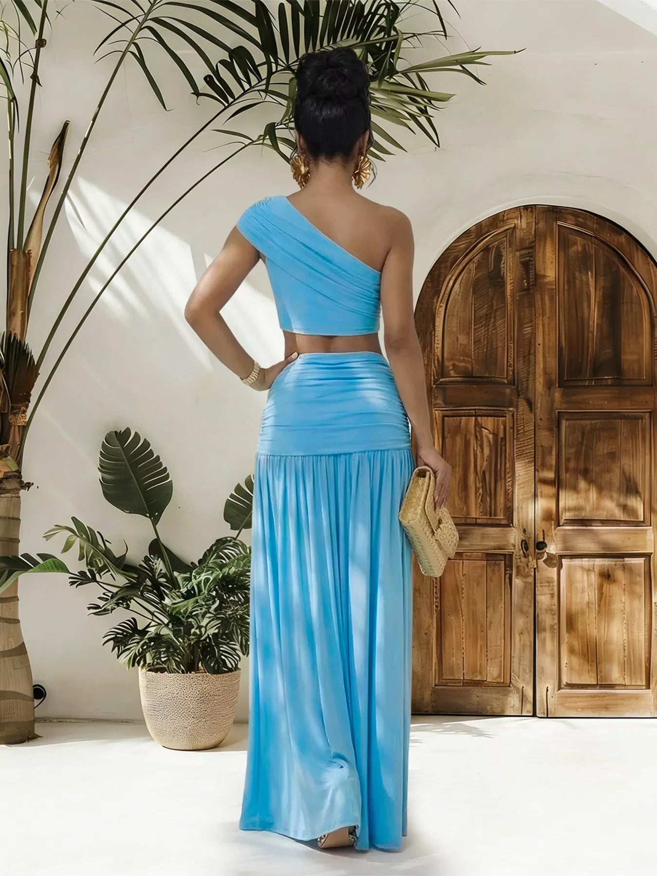 Trendsi one-shoulder top and ruched maxi skirt set, featuring a stylish off-shoulder design and fitted, ruched skirt in neutral fabric.