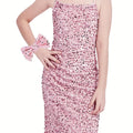 Girls black sequin velvet bodycon mini dress with party bow detail, stylish and fitted for special occasions.