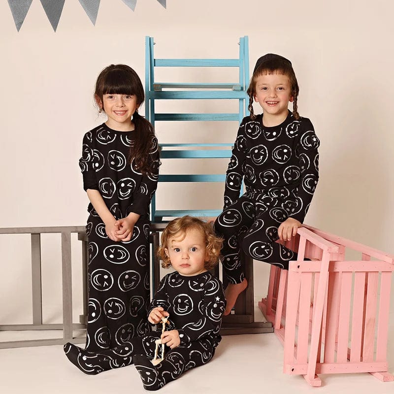 Unisex Bloom Baby Smile Print Footie Romper by Showlu Fashion, long sleeve cotton bodysuit for boys and girls, round neck.