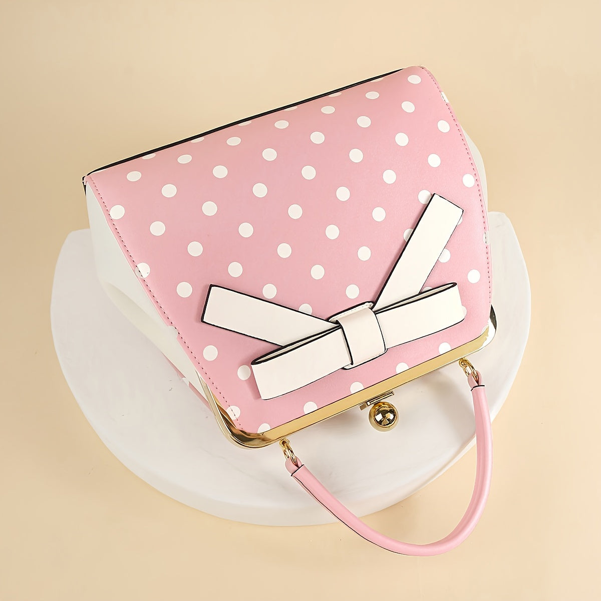 SHOWLU polka dot patent leather handbag with bow detail and kiss lock closure, stylish accessory for women.