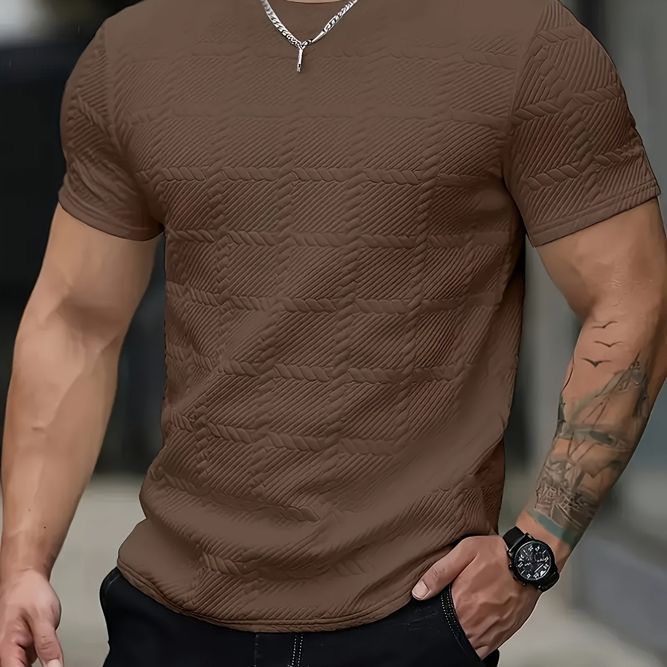 Men's SHOWLU geometric jacquard knit T-shirt with casual round neck, featuring a stylish patterned fabric design.