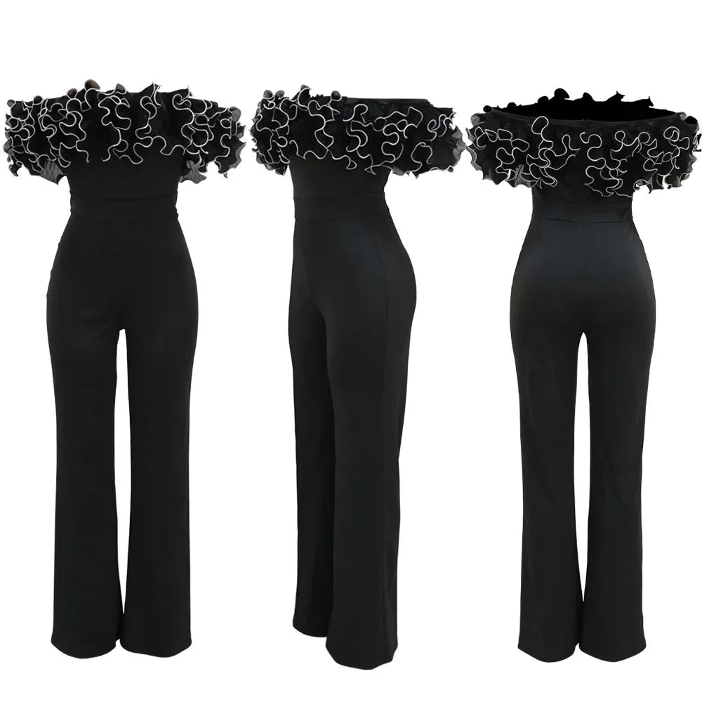 African women's dashiki jumpsuit in black and white polyester, perfect for elegant partywear and autumn occasions.