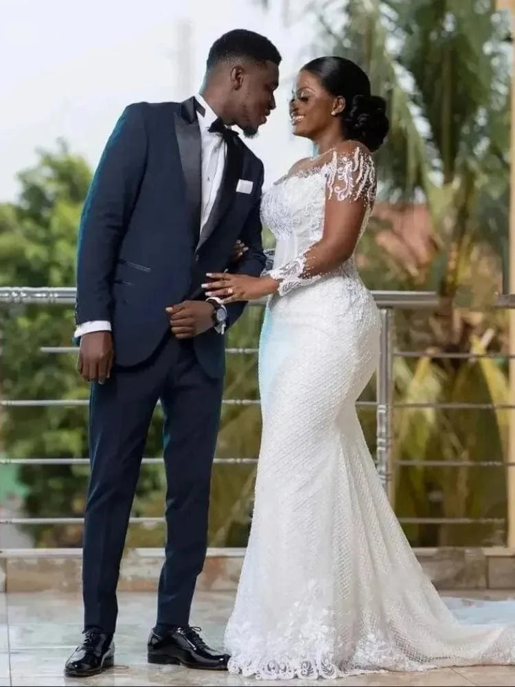 SHOWLU African Mermaid wedding dress with sheer long sleeves, tulle fabric, and elegant appliqué for a stunning bridal look.
