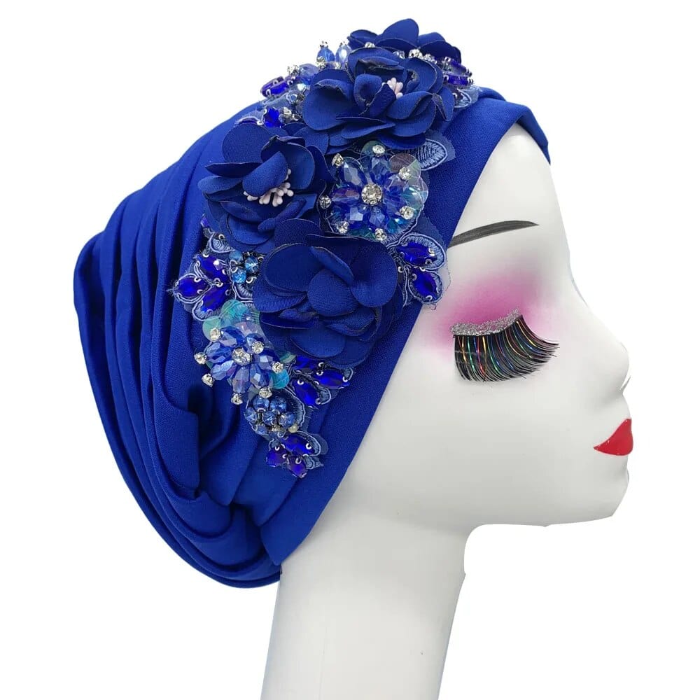 Elegant women's turban cap with floral and diamond embellishments, showcasing Showlu Fashion's Muslim hijab headwear design.