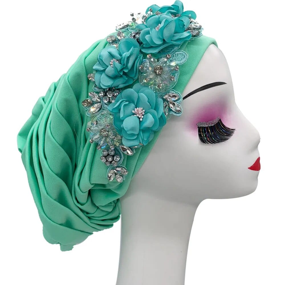 Elegant women's turban cap with floral and diamond embellishments, featuring a stylish headwrap design for Muslim hijab and party wear.