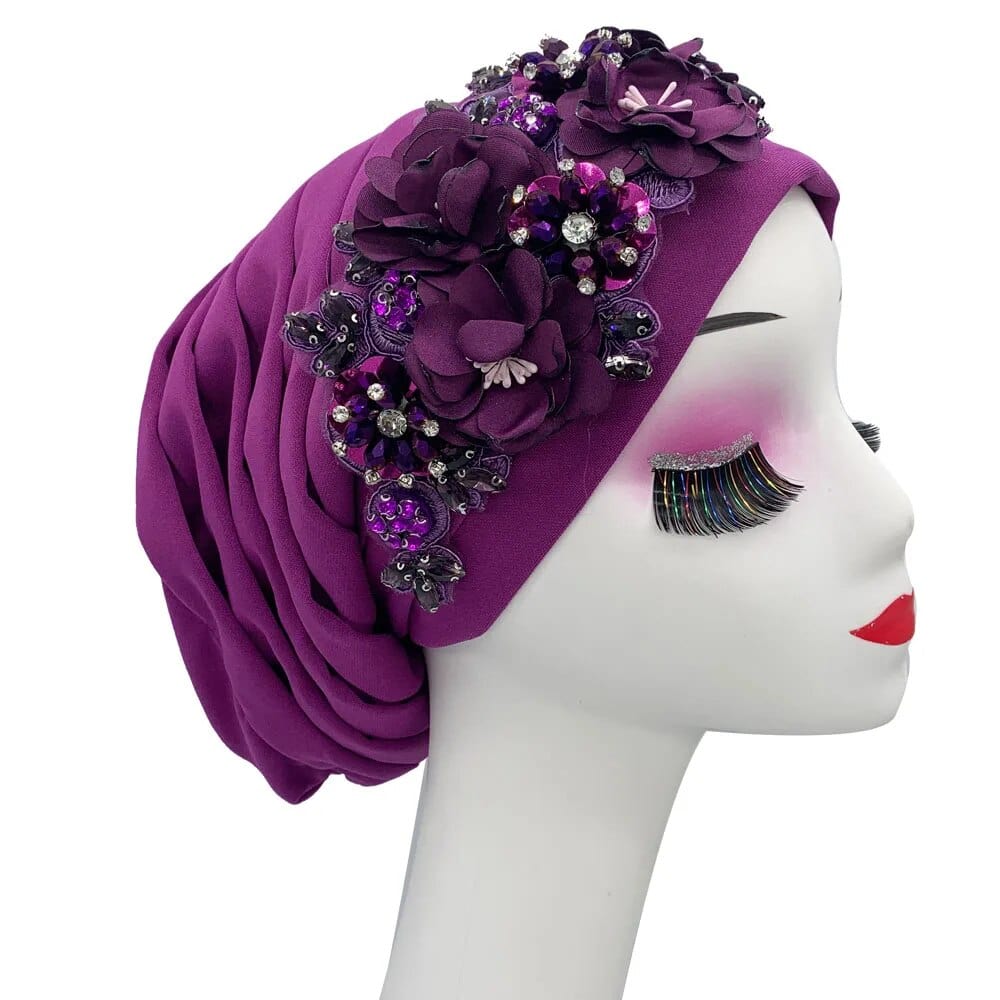 Elegant women's turban cap with floral and diamond embellishments, designed for Muslim hijab headwear and stylish African party occasions.