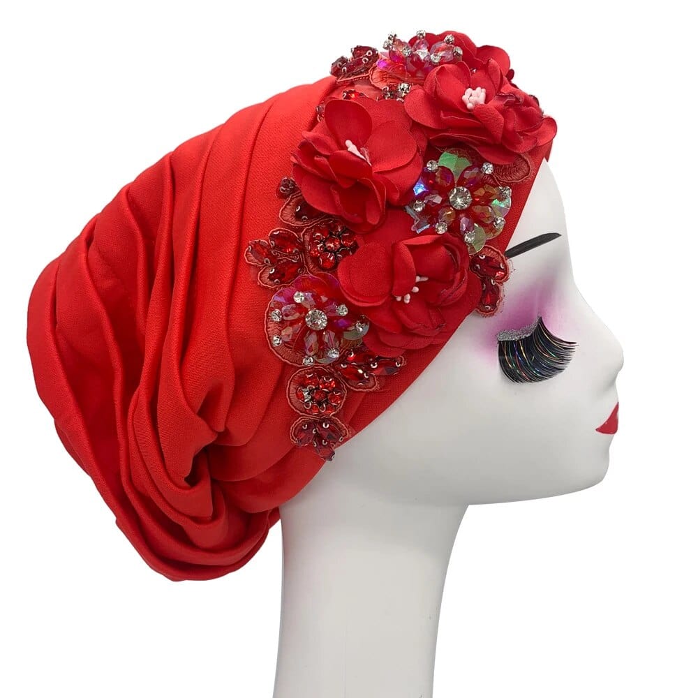 Elegant women's turban cap with floral and diamond embellishments, stylish Muslim hijab headwear for African-themed parties.