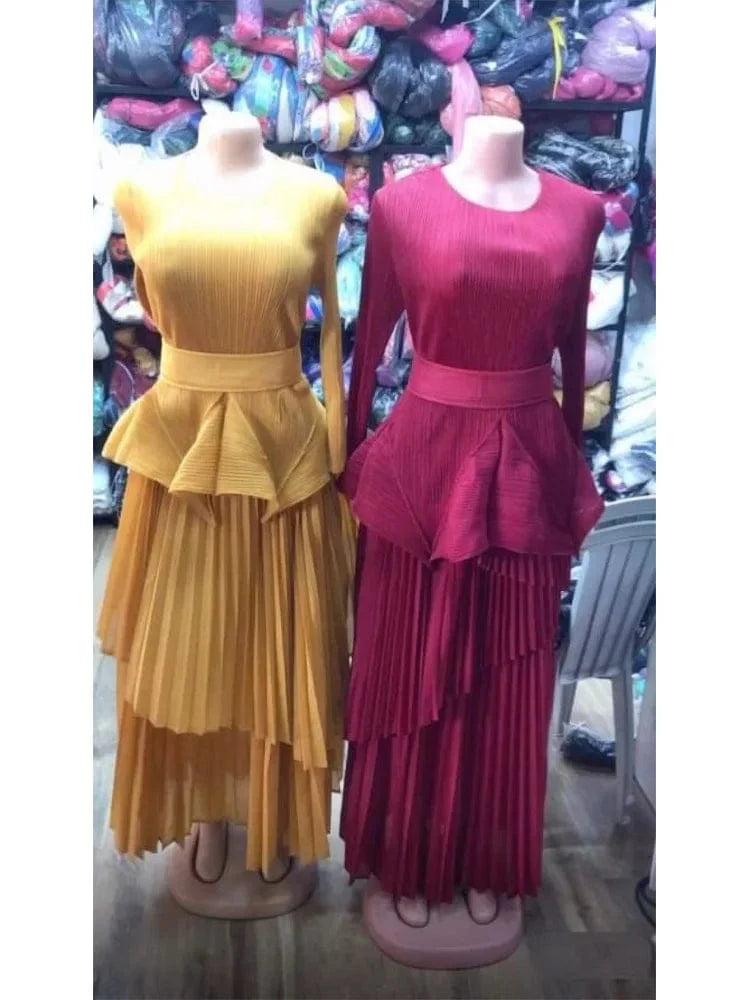 AnLAN Women's Miyake pleated 2-piece set with solid A-line long dress, round neck, gathered waist, and belt detail.
