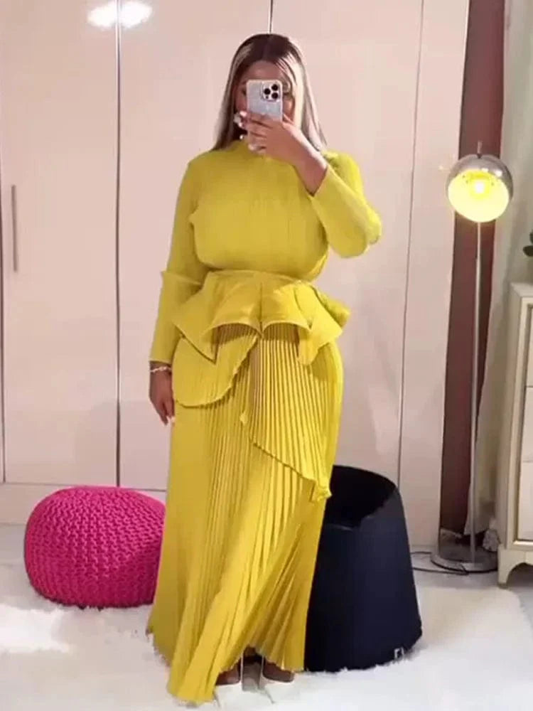 ANLAN Women's Miyake Pleated 2 Piece Set featuring a solid A-line long dress with round neck, waist gathering, and belt detail.