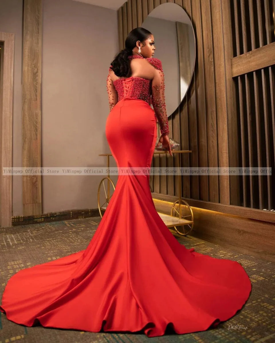 Red mermaid evening dress by SHOWLU FASHION with long sleeves, pearl beads, side slit, and illusion design for formal occasions.