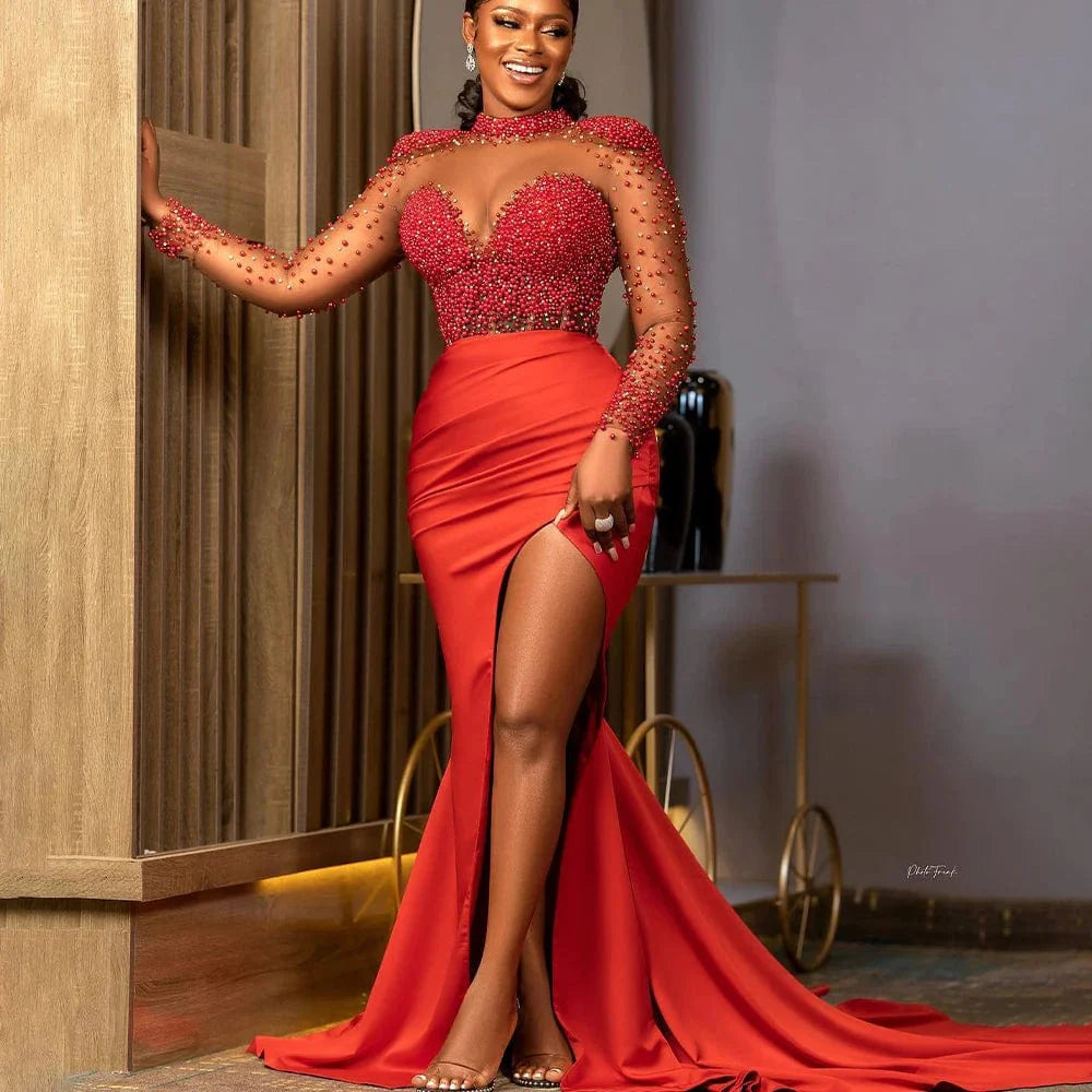 Red mermaid evening dress by SHOWLU FASHION with long sleeves, pearl beads, side split, illusion neckline, perfect for formal events.