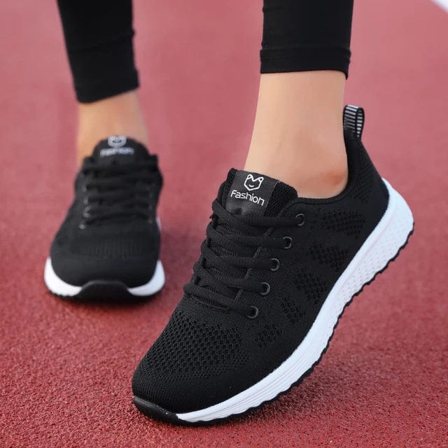 White Showlu Women's Tiger Embroidery Sports Shoes with low-top design, showcasing detailed tiger embroidery and sporty style.