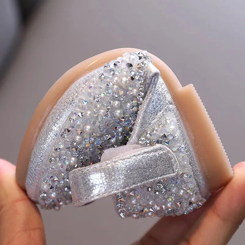 Girls rhinestone leather princess shoes with pearl bow, showing soft leather, sparkling rhinestones, and a delicate bow detail.