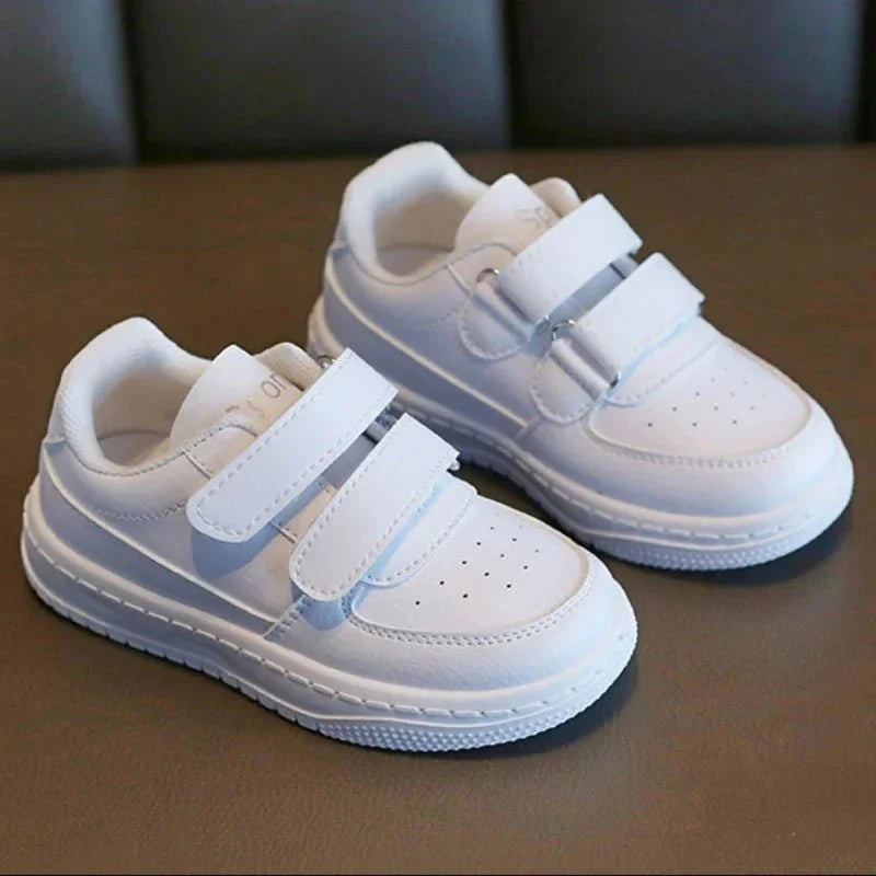 Kids white sneakers by Showlu Fashion Store, breathable non-slip sport shoes for boys and girls, ideal for active play and running.