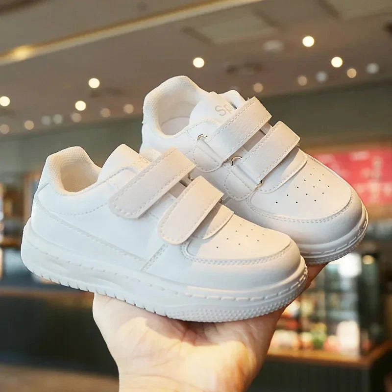 Kids white sneakers by Showlu Fashion Store, breathable non-slip sport shoes for boys and girls, perfect for running and leisure.