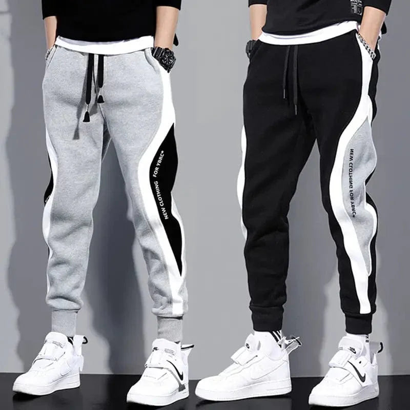 Men's loose patchwork harem pants with elastic waist, breathable fabric, and ankle-length design, perfect for casual autumn wear.