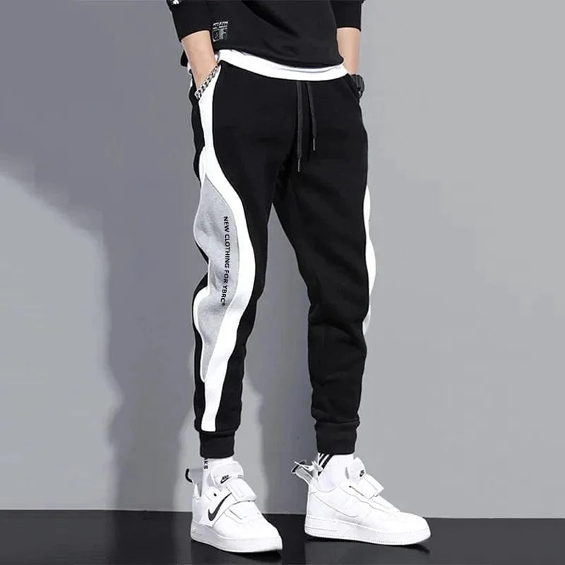 Men's loose patchwork harem pants by Showlu Fashion, ankle-length casual trousers with breathable fabric and elastic tie foot design.
