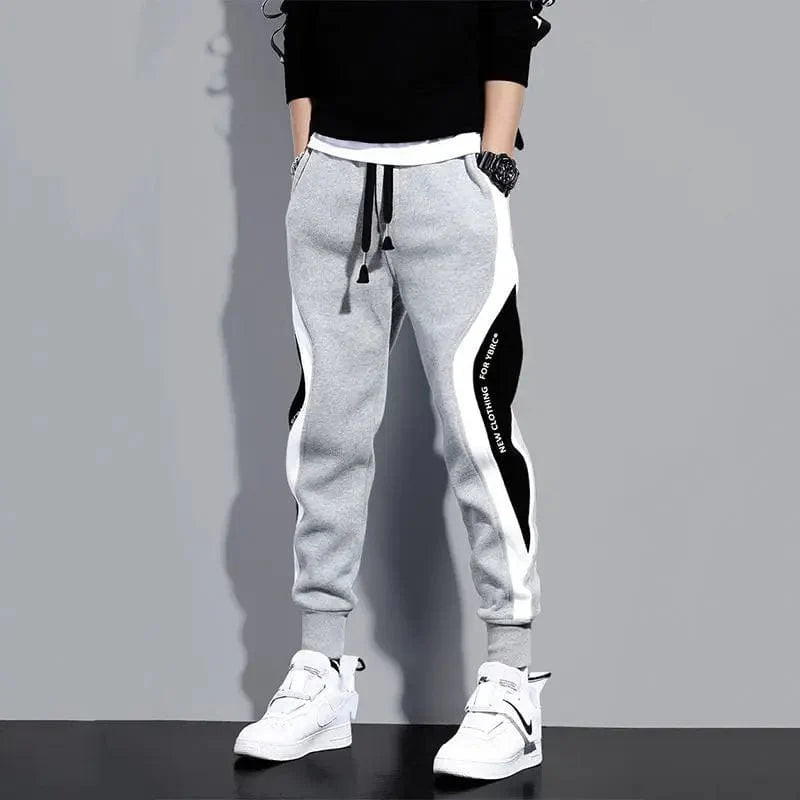 Loose patchwork men's harem pants from Showlu Fashion, featuring breathable fabric, elastic waist, and ankle-length casual style.
