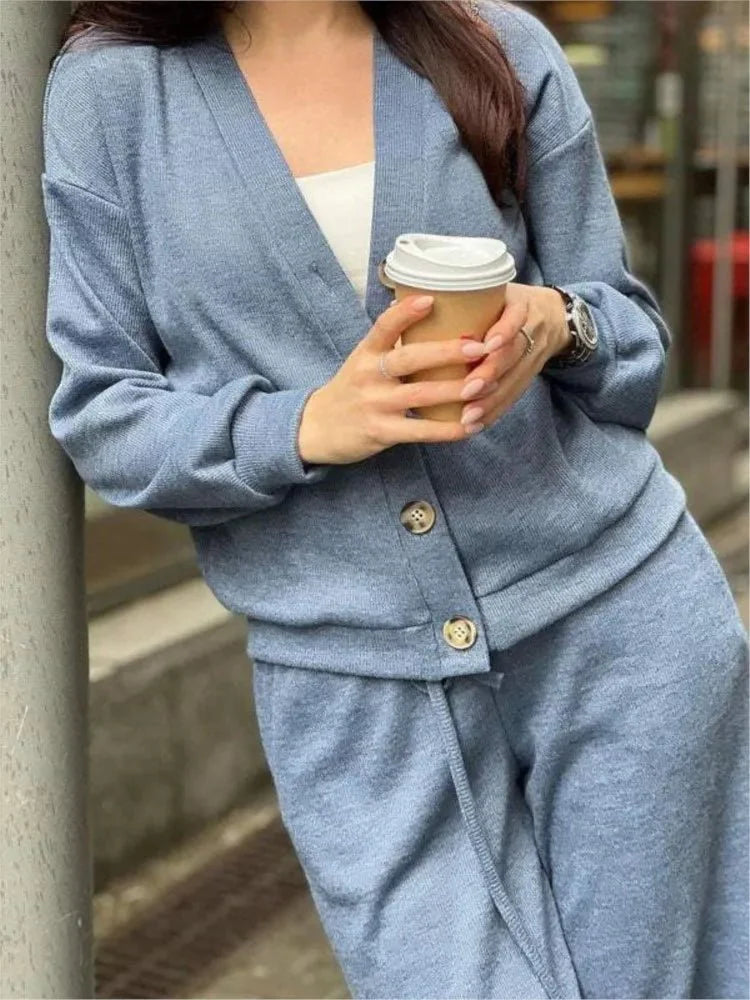 Women's two-piece knit sports suit by SHOWLU FASHION STORE featuring a single-breasted cardigan and lace-up pants for autumn wear.