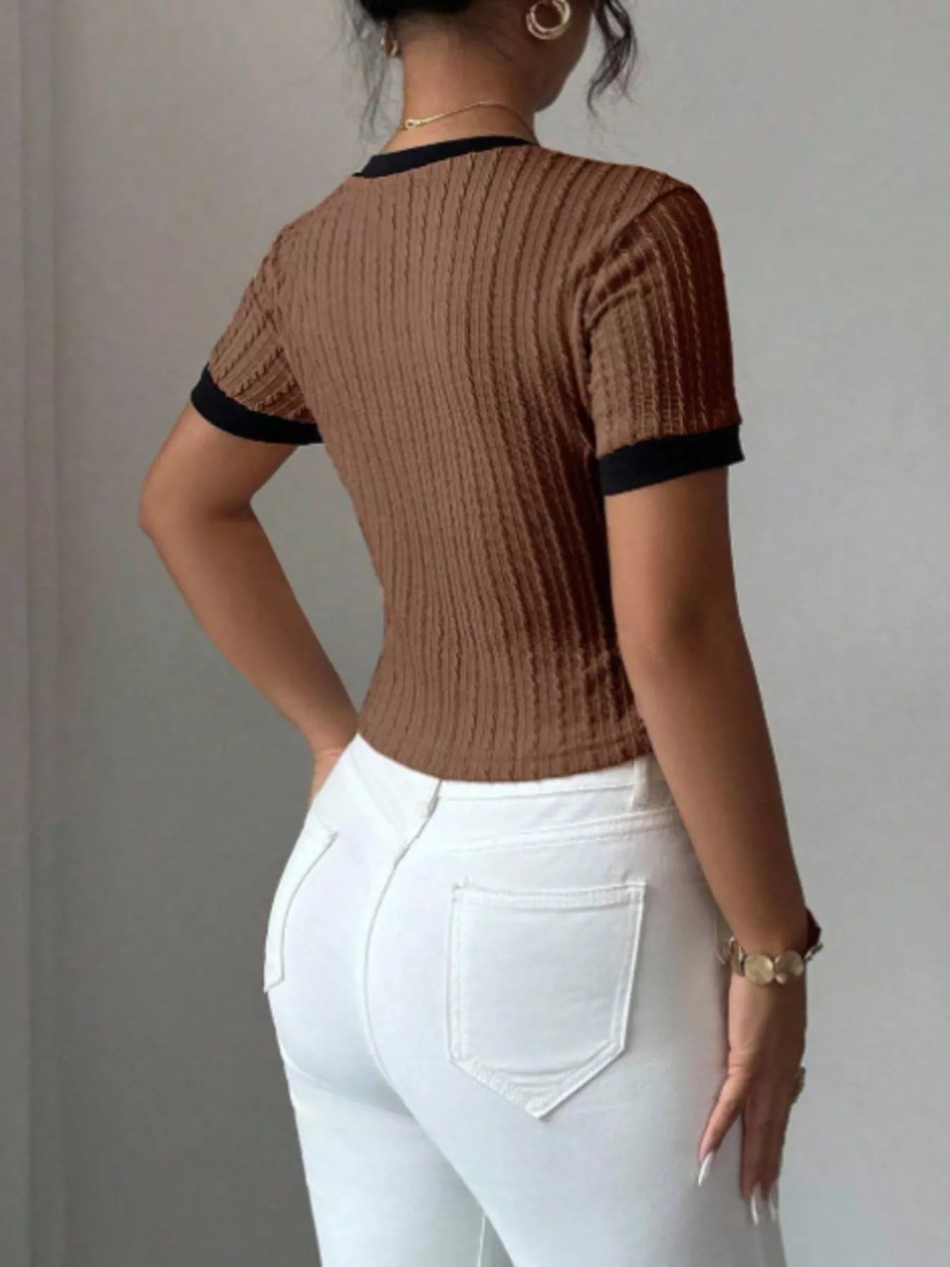 Contrast trim short sleeve T-shirt by Trendsi featuring a casual fit and stylish color accents.