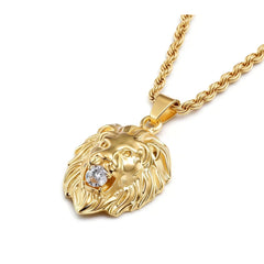 A gold-toned lion head pendant necklace featuring a clear cubic zirconia stone in its mouth.