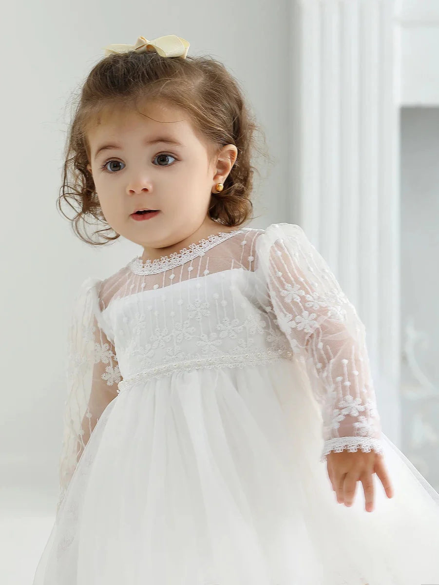 White mesh baby girl christening dress with A-line design, perfect for special occasions and parties.