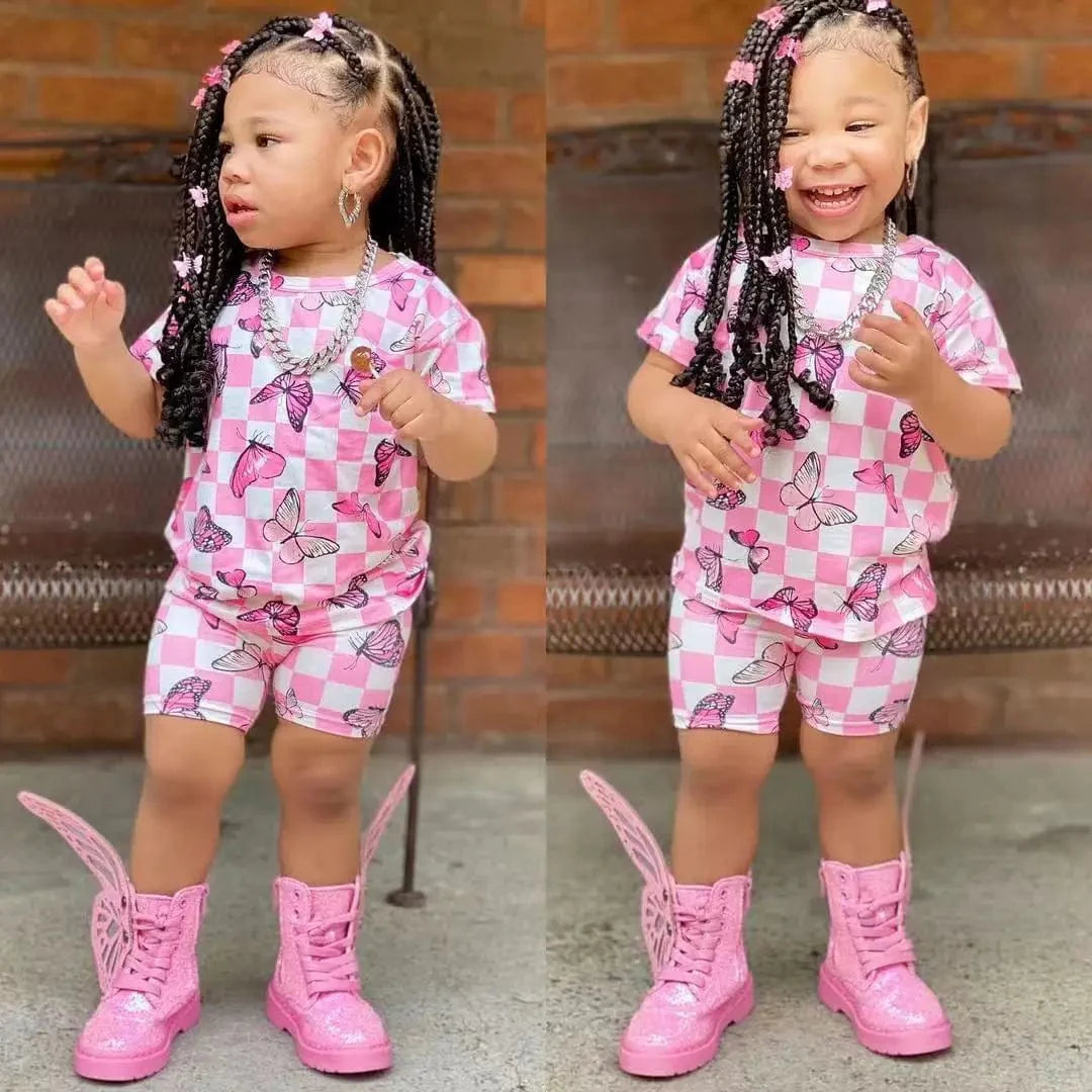 Showlu Fashion Girls summer clothing set with short sleeve rainbow top and matching colorful shorts for kids.