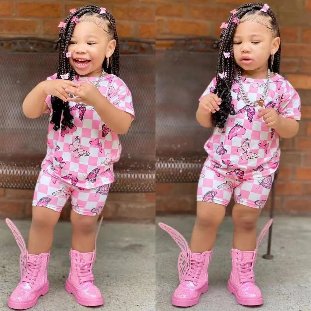 Baby girl summer outfit set with short sleeve rainbow top and matching rainbow shorts by Showlu Fashion Store.