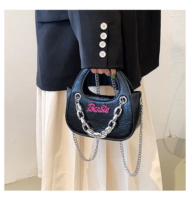 Black PU leather saddle bag for women with chain strap, stylish designer-inspired messenger bag for autumn and winter fashion.
