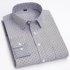 A long-sleeved men's button-down shirt with a white and black striped print pattern.