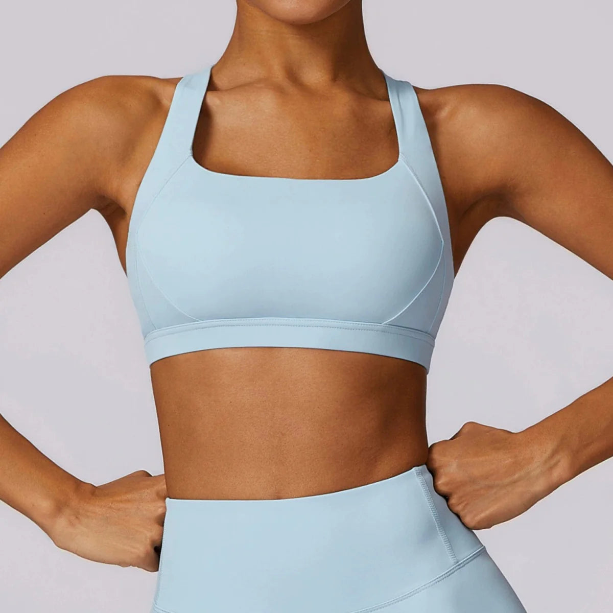 Showlu Women's Cross Back Yoga Vest with padded sports bra, designed for comfortable workout and running activities.