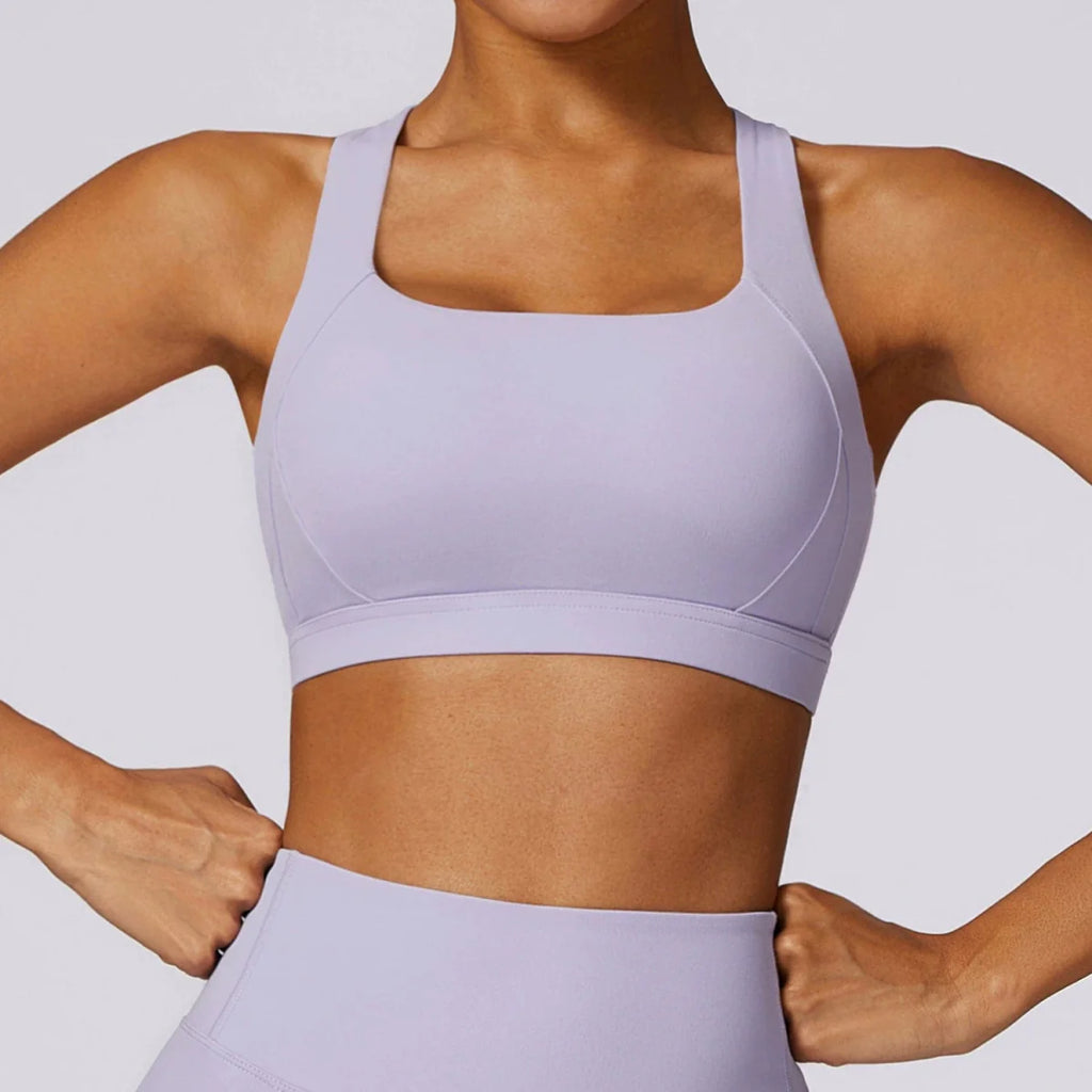 Showlu Women's Cross Back Padded Yoga Vest with built-in sports bra, designed for comfortable workout and running activities.