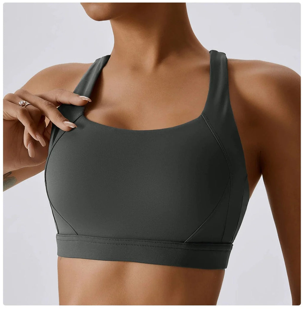 Showlu Women's cross back padded yoga vest with built-in sports bra, designed for comfortable workout and running activities.