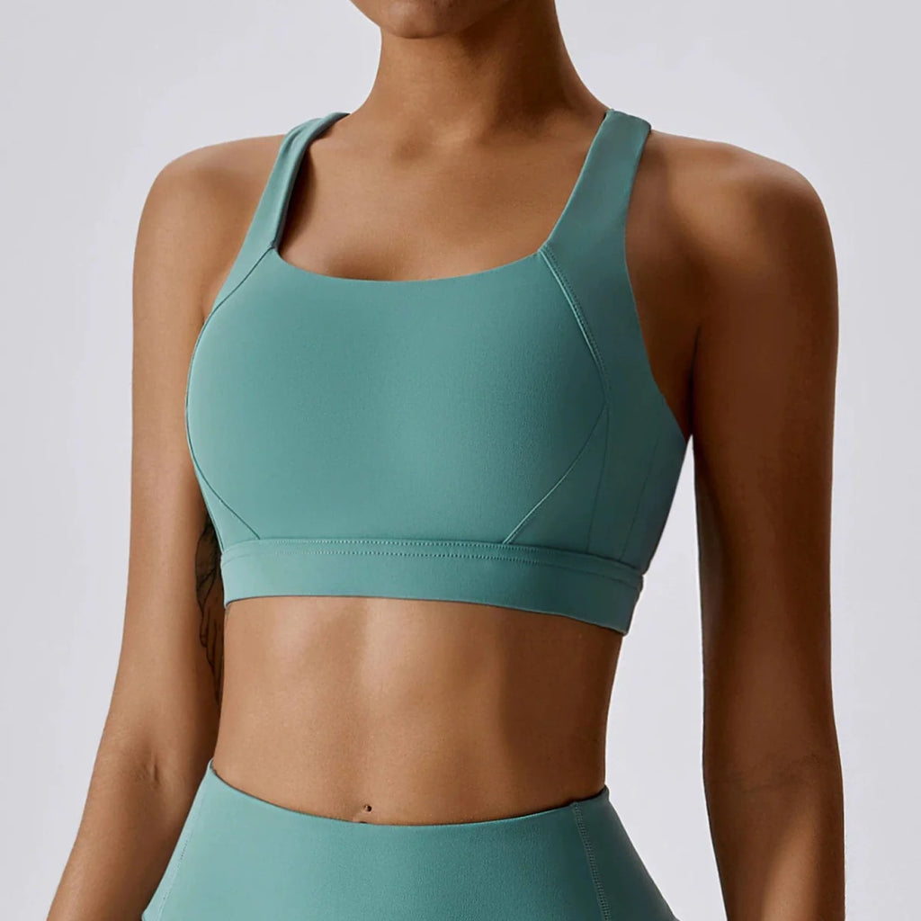 Showlu Women's Cross Back Yoga Vest with padded sports bra, designed for comfortable workout and running activities.