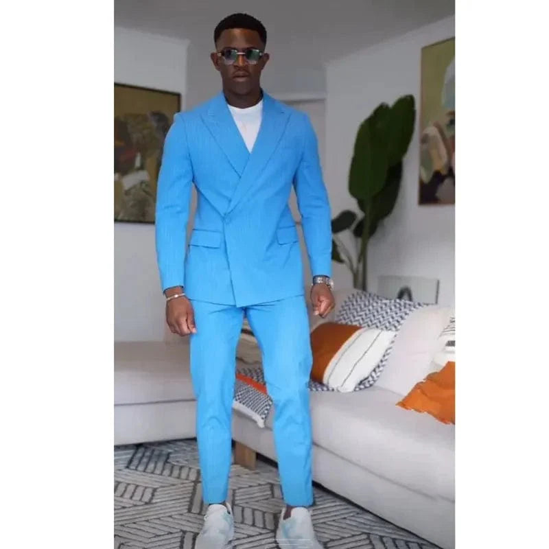 Blue men's 2-piece suit by SHOWLU FASHION STORE, slim fit tuxedo with peak lapel, single button blazer and matching trousers.