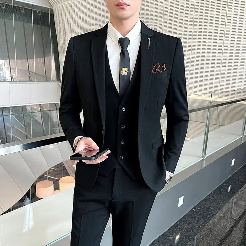Elegant men's 3-piece slim fit business suit including blazer, vest, and pants, in a stylish, tailored design.