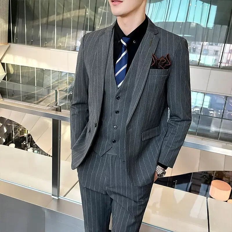 Elegant men's 3-piece slim fit business suit with blazer, vest, and trousers in a formal fashion by Showlu Fashion.