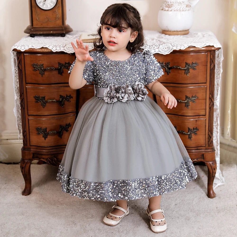 Baby girl red sequin bow dress with lace flower for birthday or party, featuring a festive, princess-style design.