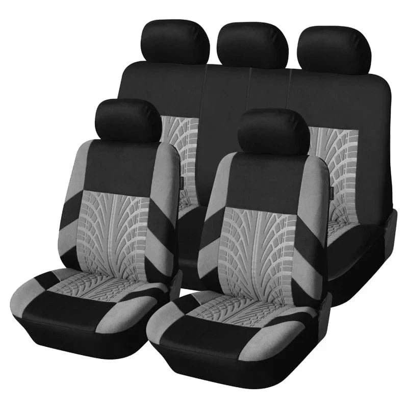 AutoYOUTH universal car seat covers set with 3D tire track design, shown with embroidered logo on front seats in a car interior.